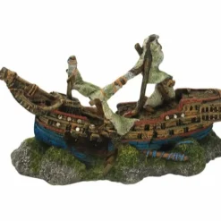 Skibsvrag på klippegrund med knækket mast